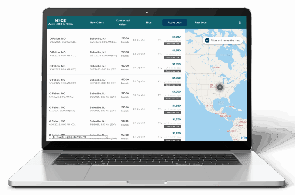 Laptop showing a freight logistics software dashboard with active jobs and map view