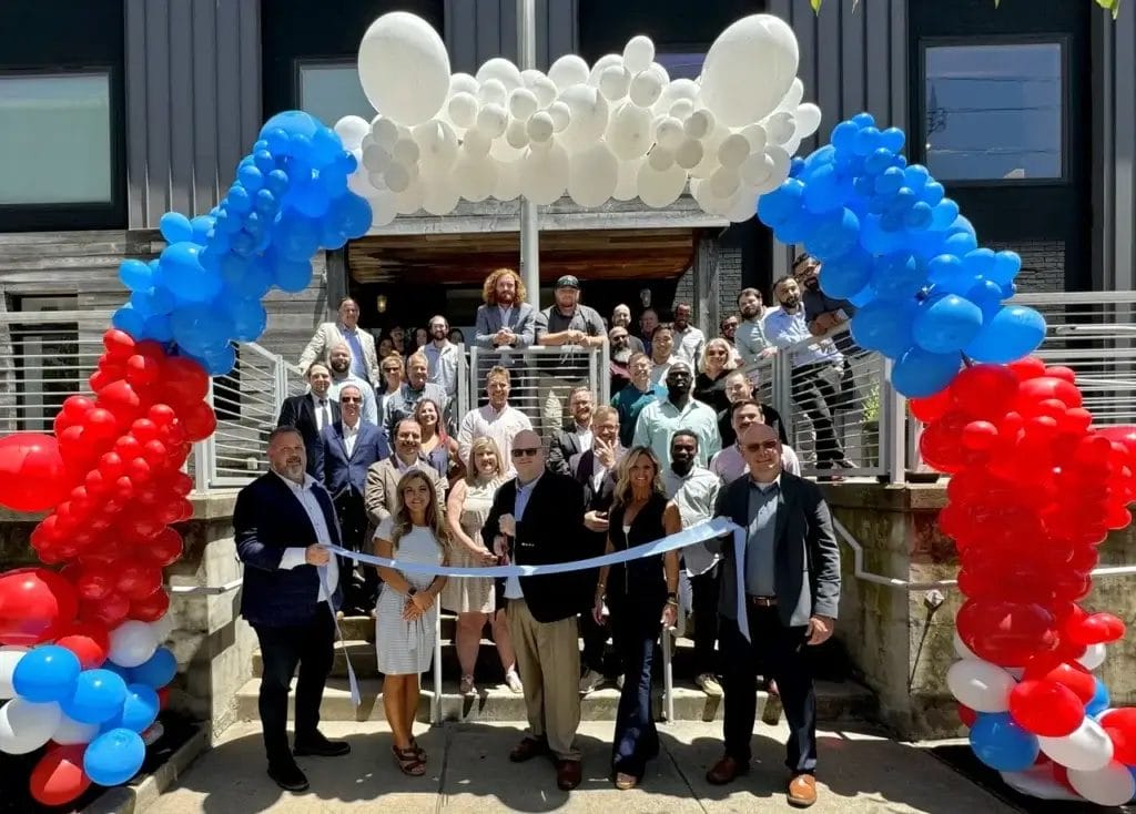 avenger team celebrating brand opening and ribbon cutting ceremony